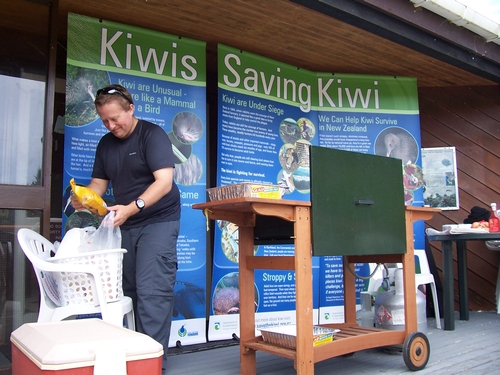 Simon Wear attends to the barbeque on Day One of the Kiwi Avoidance Training weekend at the Rimutaka Forest Park