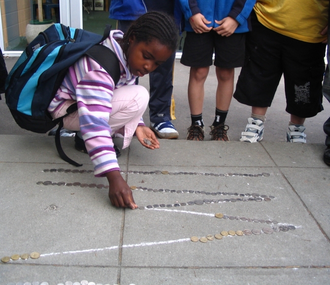 Primary school children are seen here raising funds via a "coin trail" to support the Kiwi Project