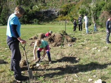 Family planting native trees, Catchpool Valley